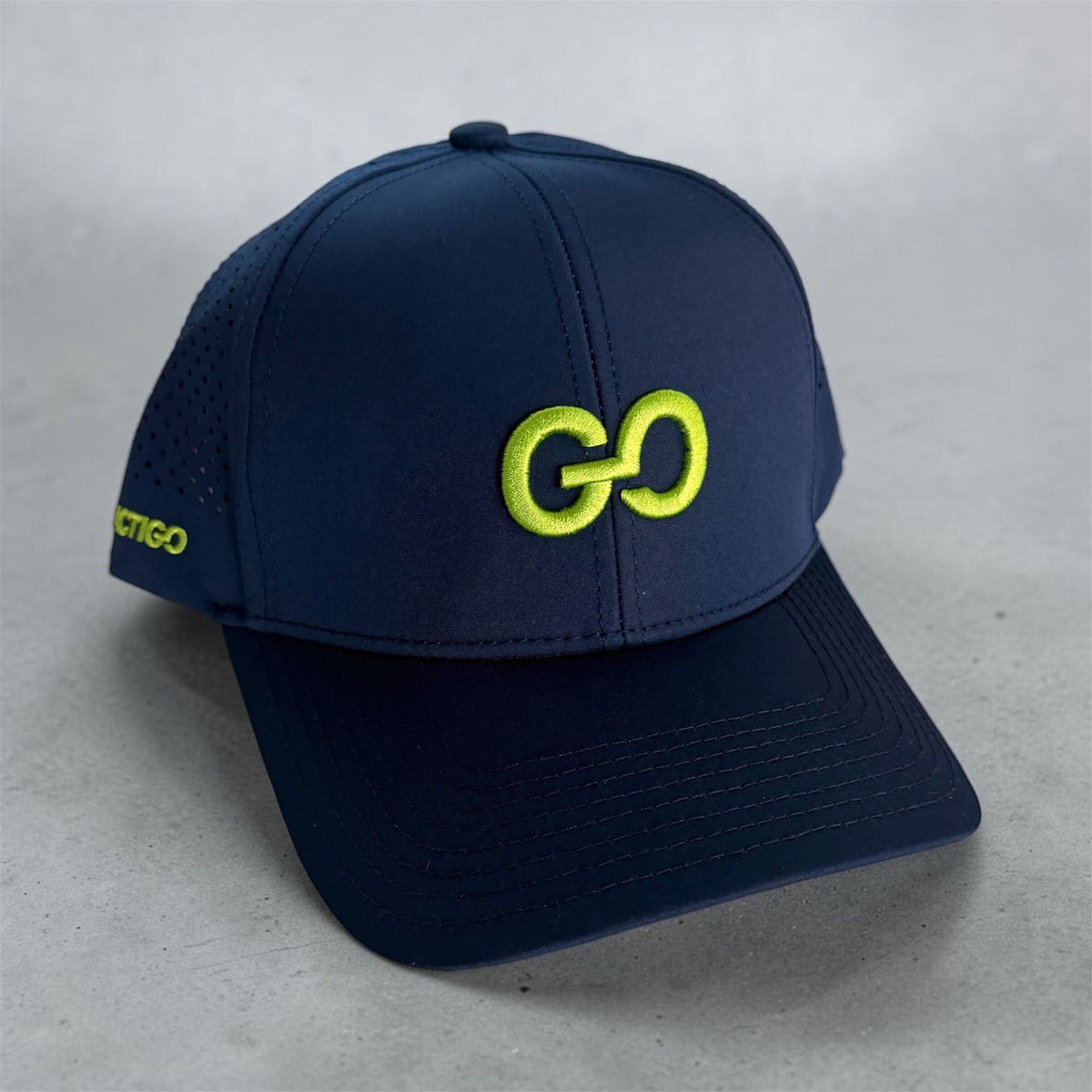 Navy LactiGo hat with lime green embroidered GO logo, front view