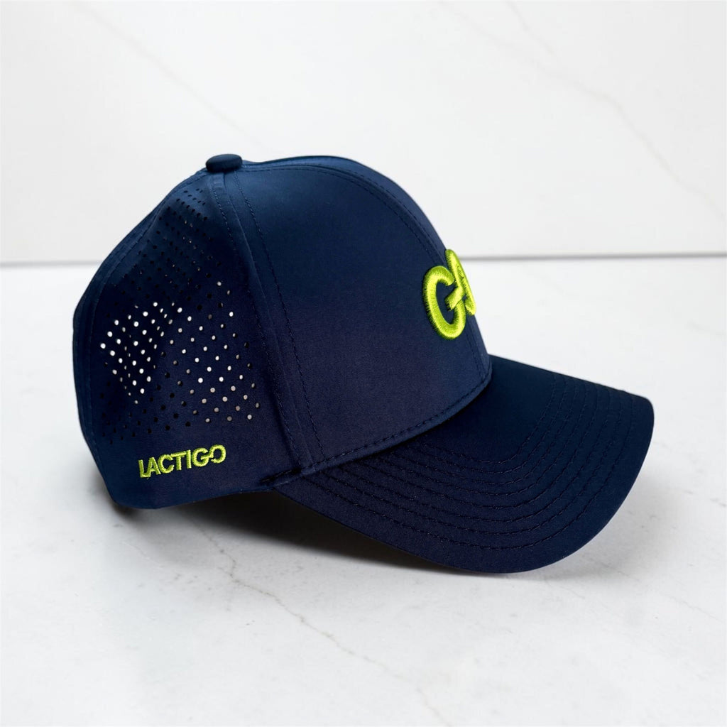 Navy LactiGo hat with perforated side panels and lime green embroidery, side view